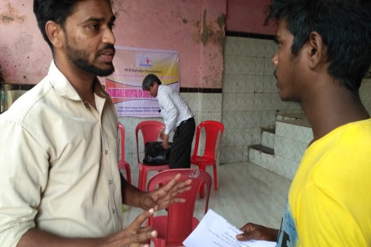 Medical camp-social worker interacting with addict